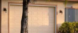 Wide garage double door and concrete driveway of new modern american house.